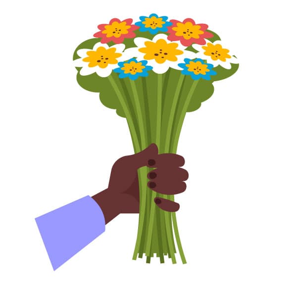 Mano negra sosteniendo flores