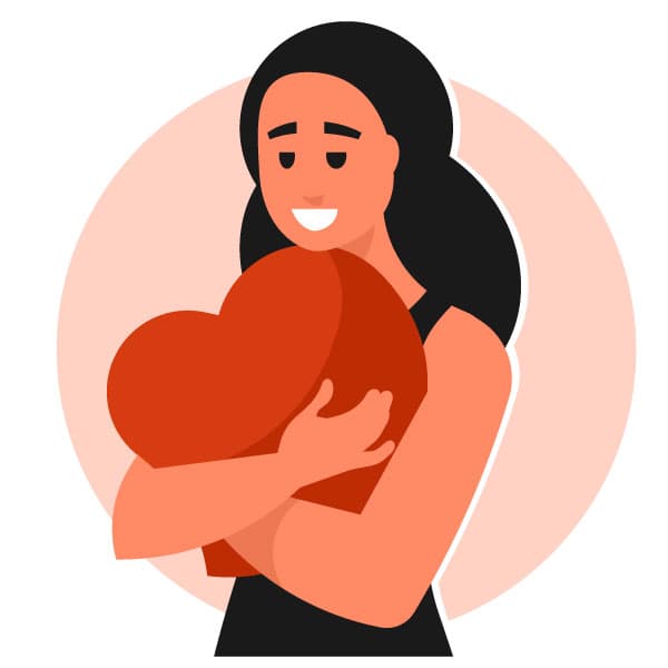 Woman cuddling a heart-shaped pillow